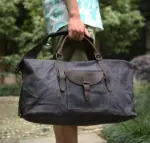 Turubai waxed canvas travel carried by the handles