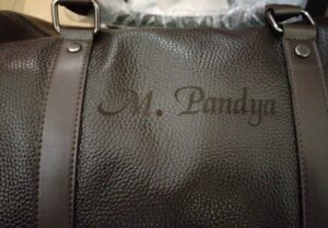 Leather weekender bag with shoe compartment engraved