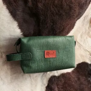 Sarabi leather toiletry in printed green
