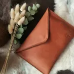 Leather pouch on table