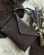Leather pouch on table