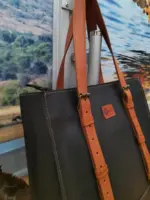 Black leather tote with brown straps