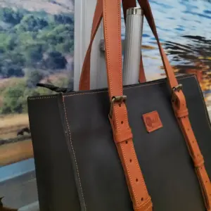Black leather tote with brown straps