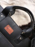 Leather laptop sleeve on desk