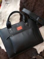 Leather laptop sleeve on desk