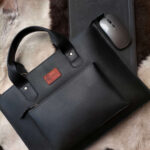 Leather laptop sleeve on desk