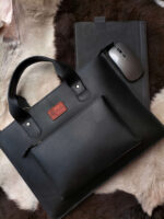 Leather laptop sleeve on desk