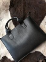 Leather laptop sleeve on desk