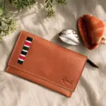 Malkia beaded leather clutch in Chestnut