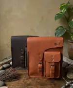 Leather sling bags on a table