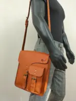 Leather sling bag on a mannequin