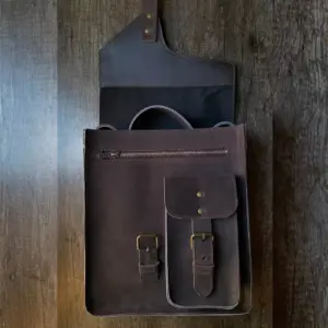 Leather sling bag on a table