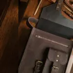 Leather sling bag on a table