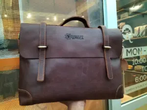Corporate logo engraved on a Qali leather briefcase