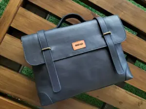 Custom branding on the leather logo patch of a Qali bag
