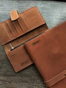 Multiple Qali leather items with custom engraved branding
