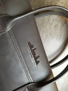 Nairobi graphic engraved on a Qali leather bag